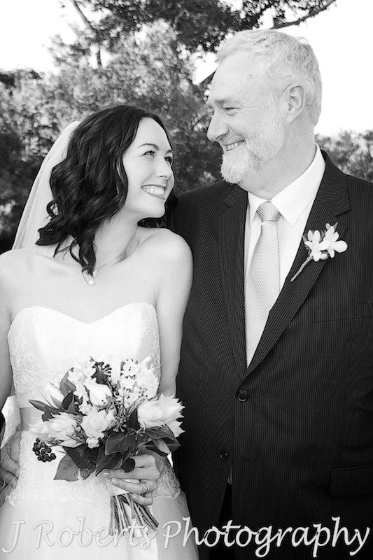 Bride smiling up at her father - wedding photography sydney